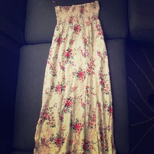 A strapless down to the feet dress with roses
